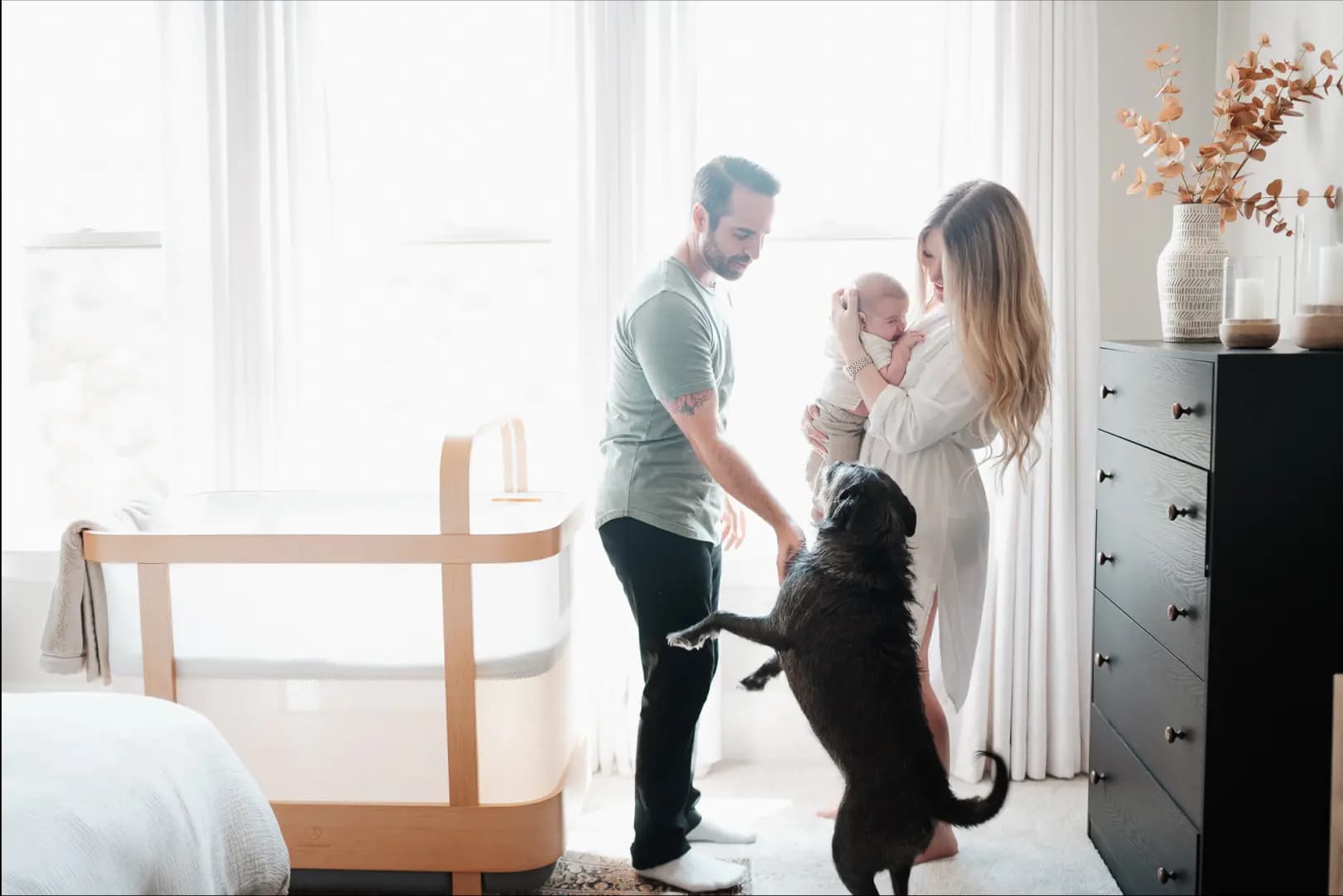 Family enjoying time in the nursery with the Cradlewise crib