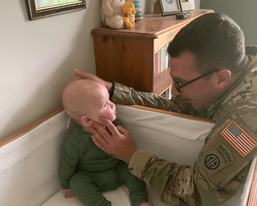 Evan and their baby with a Cradlewise smart crib